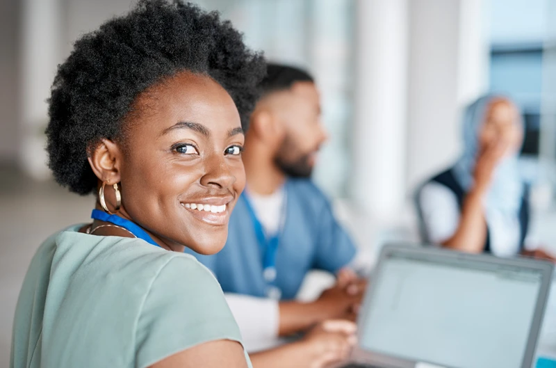 Black woman, portrait or doctor in meeting planning a surgery strategy or speaking of medical results in hospital. Teamwork, smile or happy healthcare workers consulting, talking or working on ideas